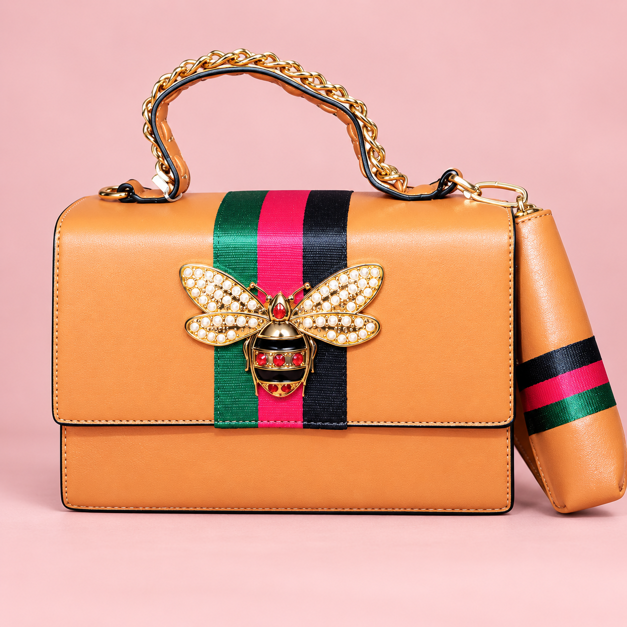 Tan structured handbag and pouch with jeweled bee and striped accents