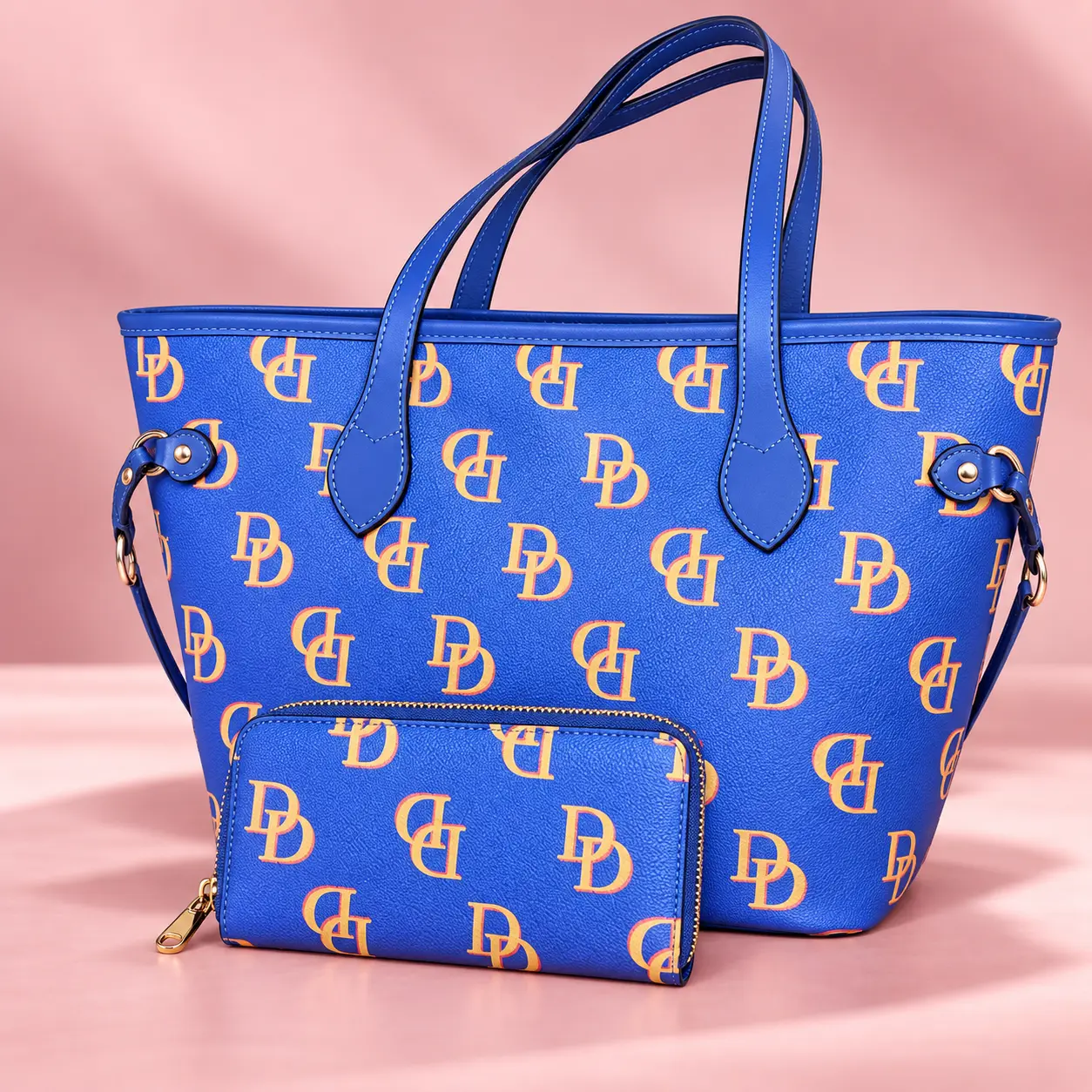 Blue monogram tote and matching wallet with gold hardware